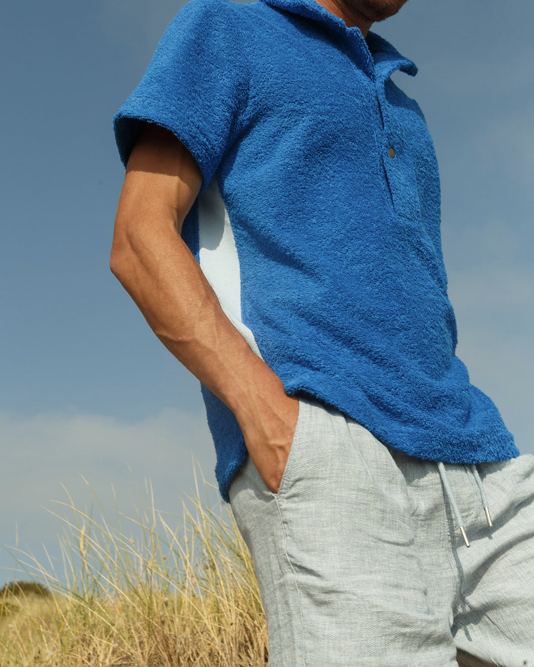 So English Brighton Blue polo shirt, made in the UK, featuring a classic polo design with a vibrant blue color.