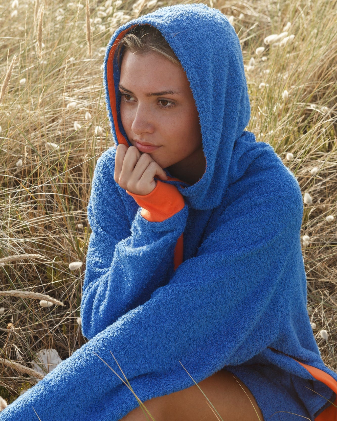 Bright blue and orange long hoodie by So English, featuring a casual beachwear style, made in the UK.