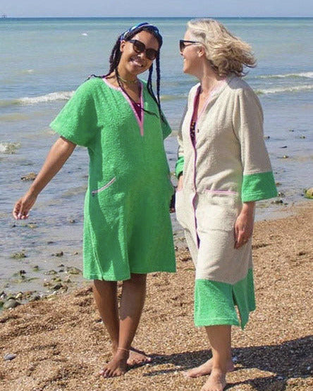 So English Kiss dress in fresh green, short style, showcasing casual beachwear with a vibrant, lightweight fabric.