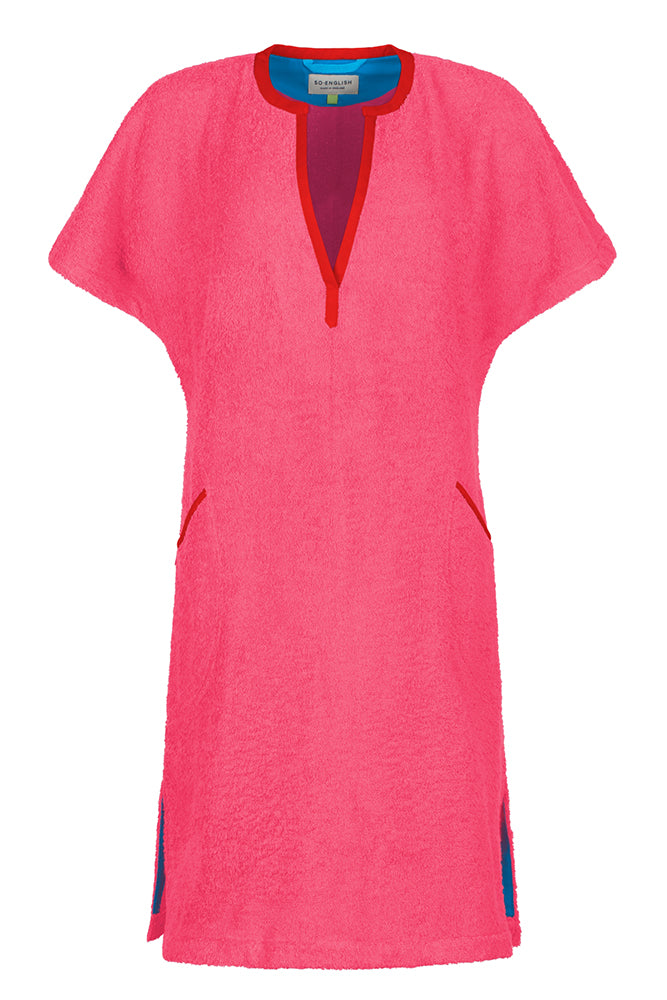 Short pink Kiss dress by So English featuring a stylish, vibrant design, perfect for beachwear and casual summer outings.