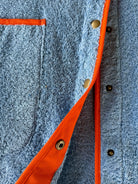 Ramona blue long towelling robe with orange button detail close up