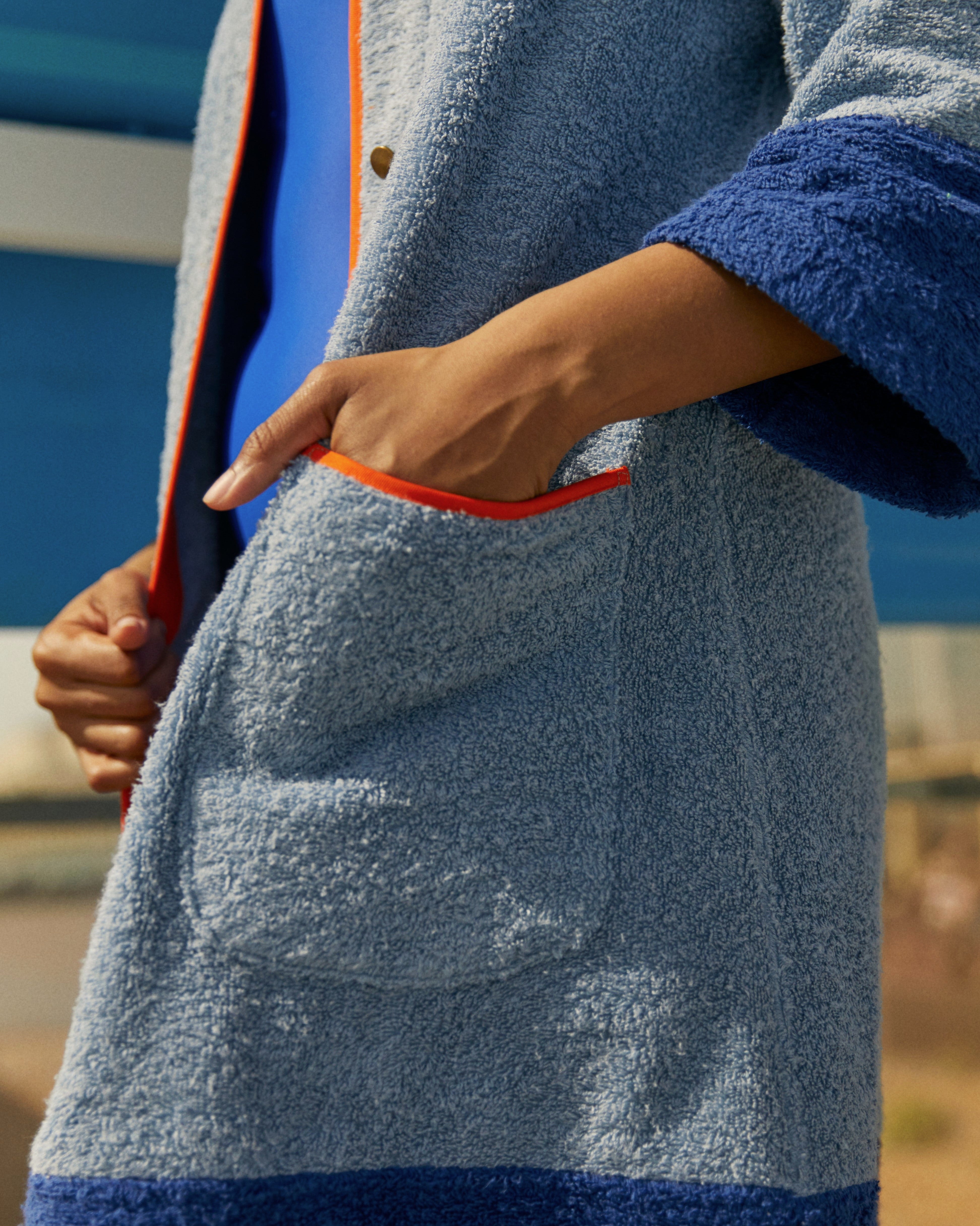Blue Ramona short robe dress by So English, lightweight beachwear with a relaxed fit, shown on a model.