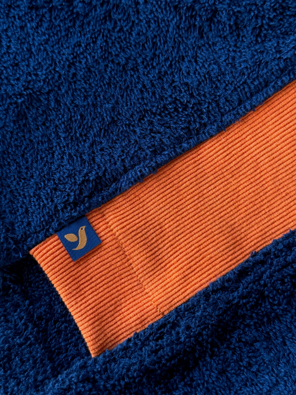 Navy and orange Bear shorts by So English, made in the UK, featuring a comfortable stretch fabric and casual beachwear style.