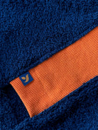 Navy and orange Bear shorts by So English, made in the UK, featuring a comfortable stretch fabric and casual beachwear style.