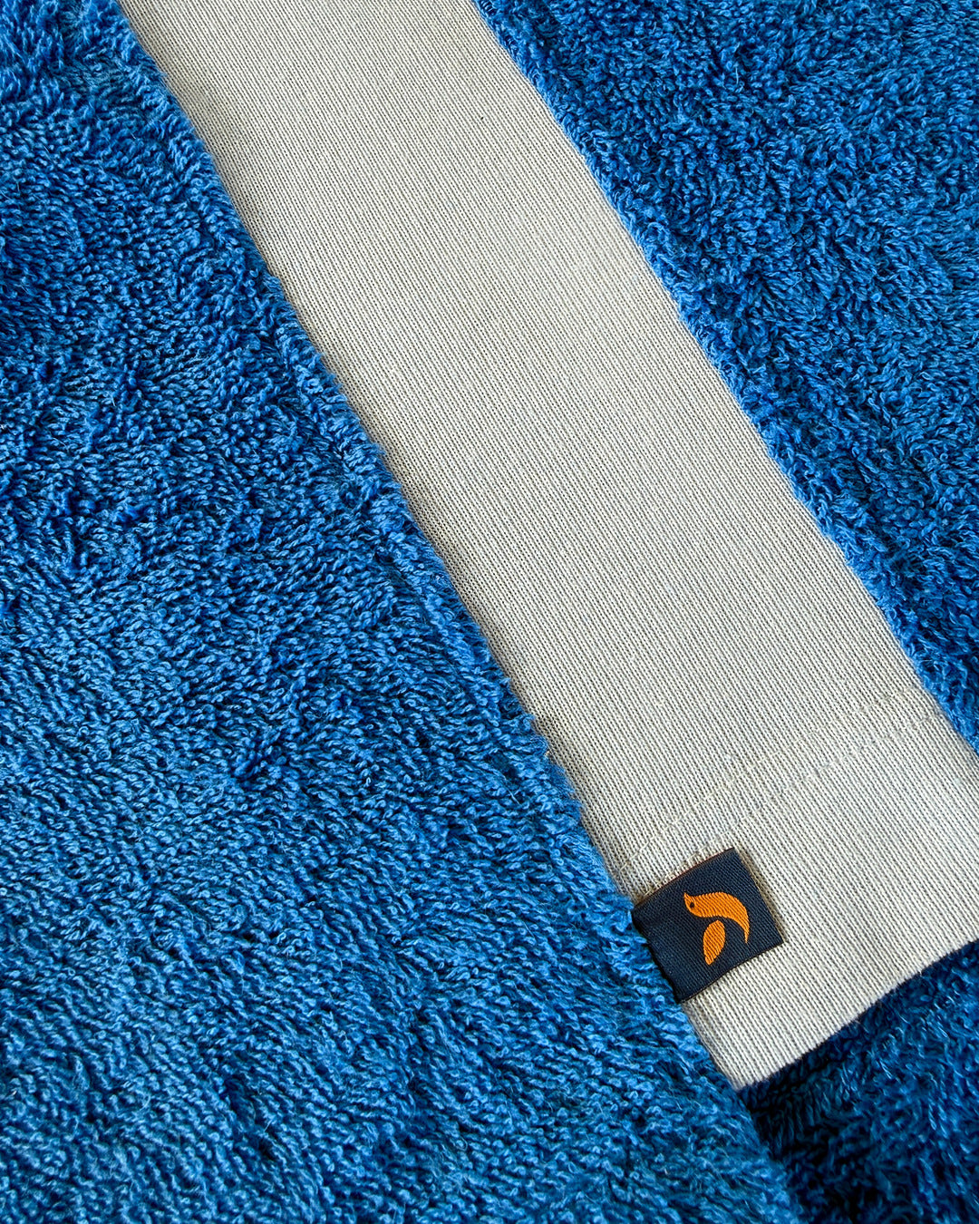 So English Bond polo shirt in Brighton Blue with detailed hem, made in the UK, featuring a classic casual men's shirt style.