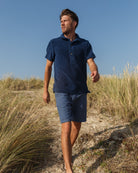 Navy Bond polo shirt by So English, casual men's shirt with a classic collar and short sleeves, styled for beachwear.
