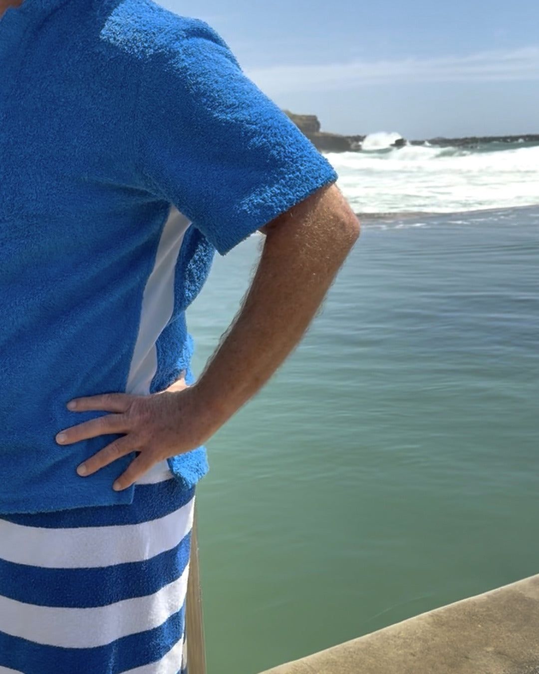So English Bond polo shirt in Brighton Blue, front view showing classic fit, soft cotton fabric, and subtle branding details.