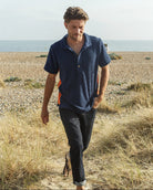 So English navy and orange polo shirt, stylish men's casual shirt with a classic fit and vibrant color block design.