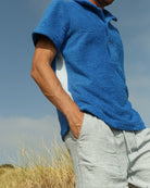 So English Brighton Blue polo shirt, made in the UK, featuring a classic polo design with a vibrant blue color.