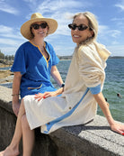 Ecru and sky blue long hoodie by So English, showing the relaxed fit and soft fabric, suitable for casual beachwear style.