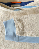 Long ecru and sky blue hoodie by So English with sleeve detail, casual beachwear style, made in the UK.