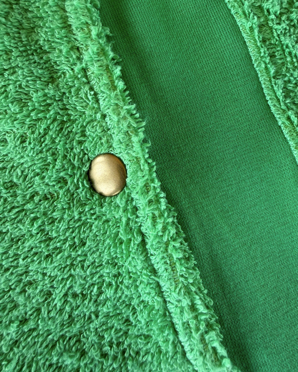 Fresh green Bude long hoodie by So English, shown with hood and front popper details, made in the UK.