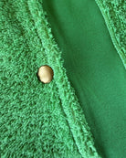 Fresh green Bude long hoodie by So English, shown with hood and front popper details, made in the UK.