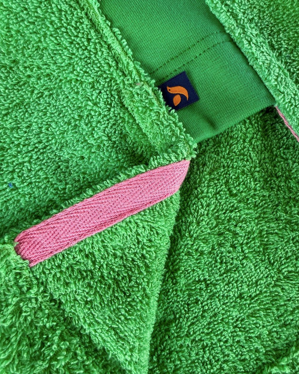 Fresh green So English Bude long hoodie with split detail, casual streetwear style, made in the UK, shown on a model.