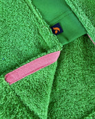 Fresh green So English Bude long hoodie with split detail, casual streetwear style, made in the UK, shown on a model.