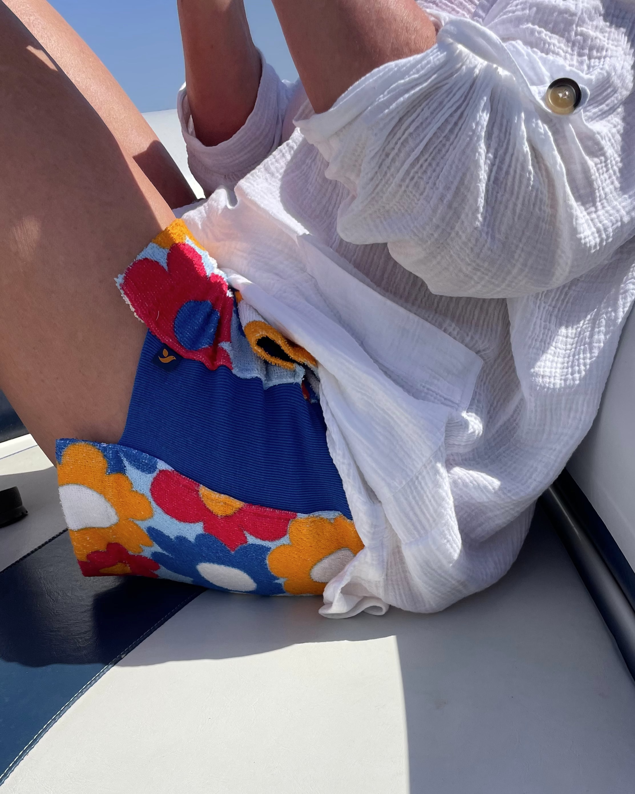 So English Carly print shorts featuring colorful beachwear design, made in the UK, with a relaxed fit and vibrant pattern.