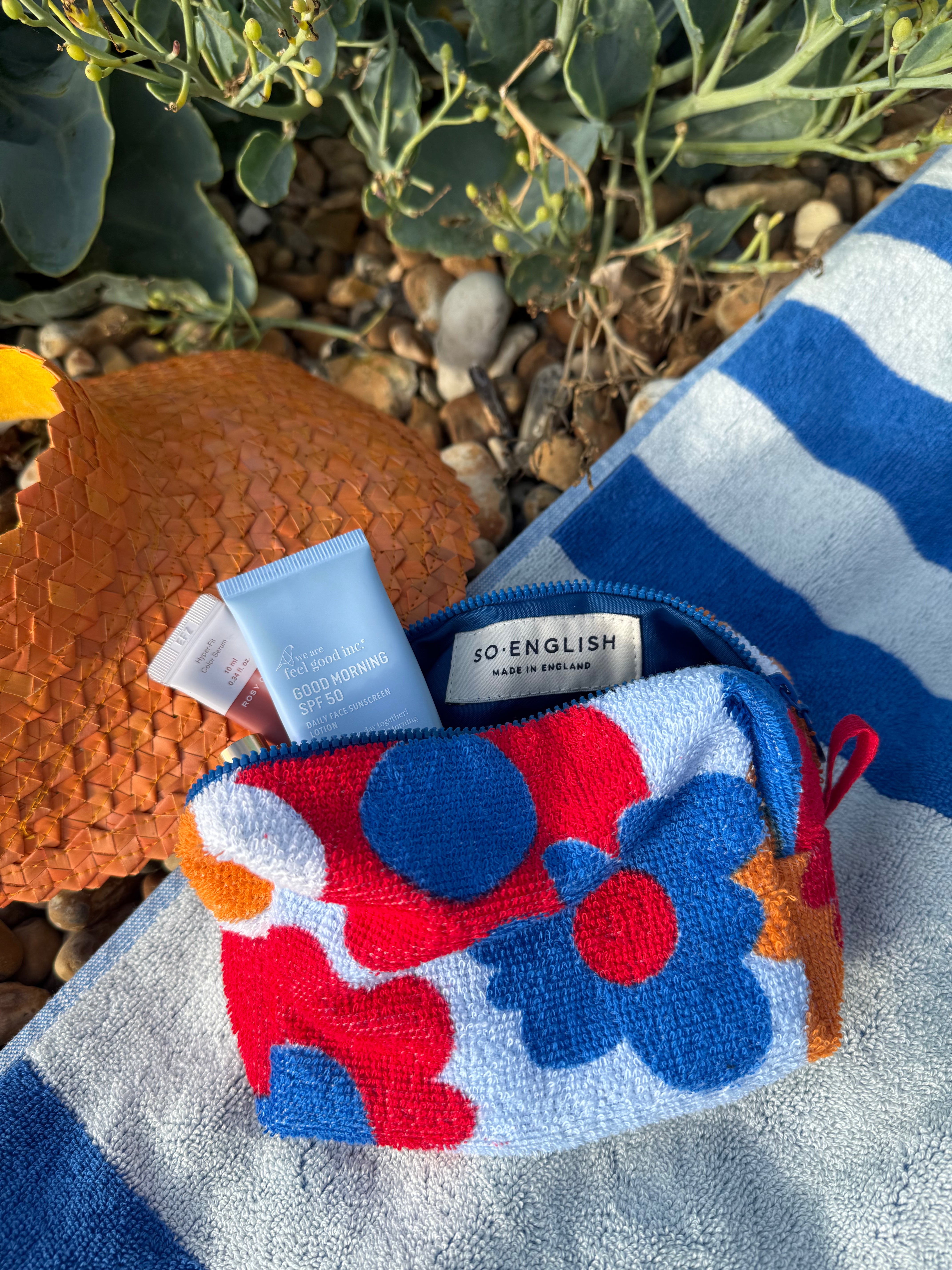 So English beachwear pochette bag with stylish design, made in the UK, featuring a compact and fashionable accessory for summer outings.