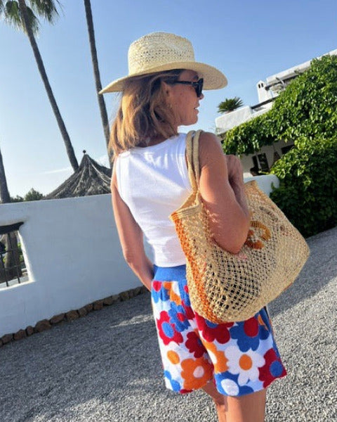 So English Carly print shorts featuring vibrant beachwear design, made in the UK, with a relaxed fit and colorful pattern.