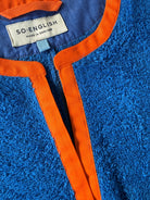 So English Kiss Brighton Blue short dress with neck detail, made in the UK, featuring a stylish blue beachwear design.