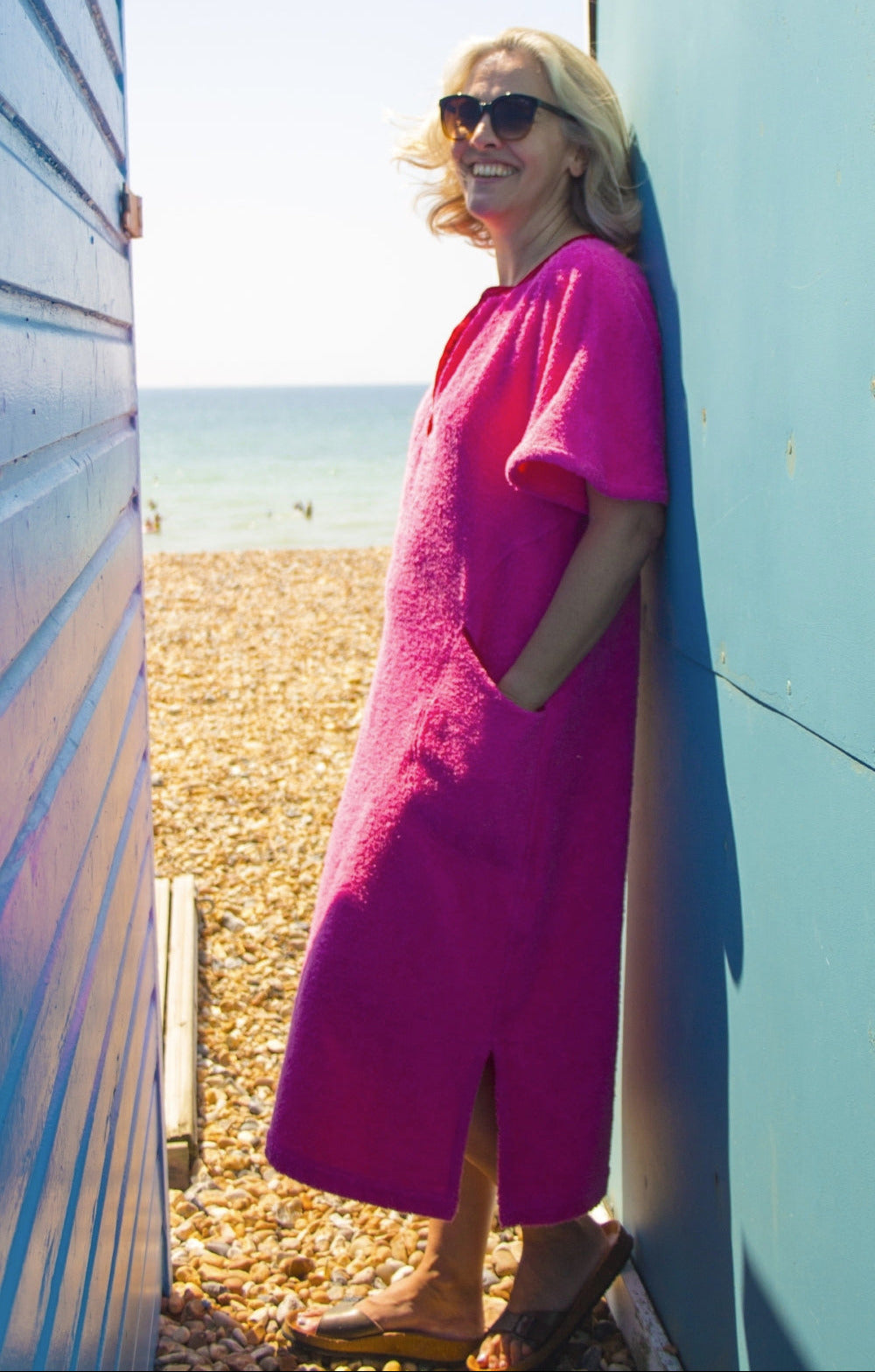 So English Kiss Precious Pink long dress featuring a soft pink fabric and a stylish, flowing design, perfect for beachwear or summer outings.