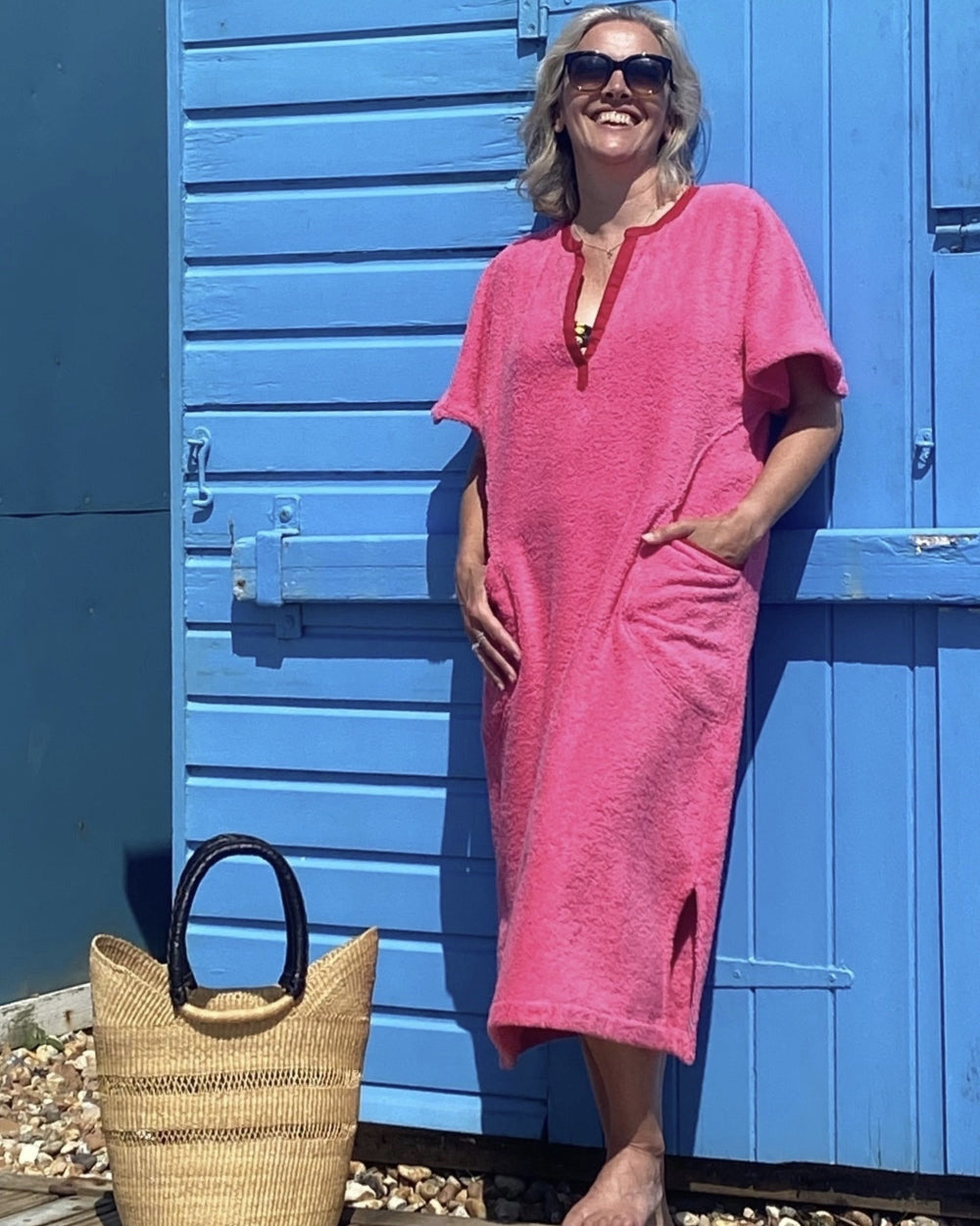 Long pink Kiss dress by So English, featuring a stylish design, perfect for beachwear or casual summer outings.