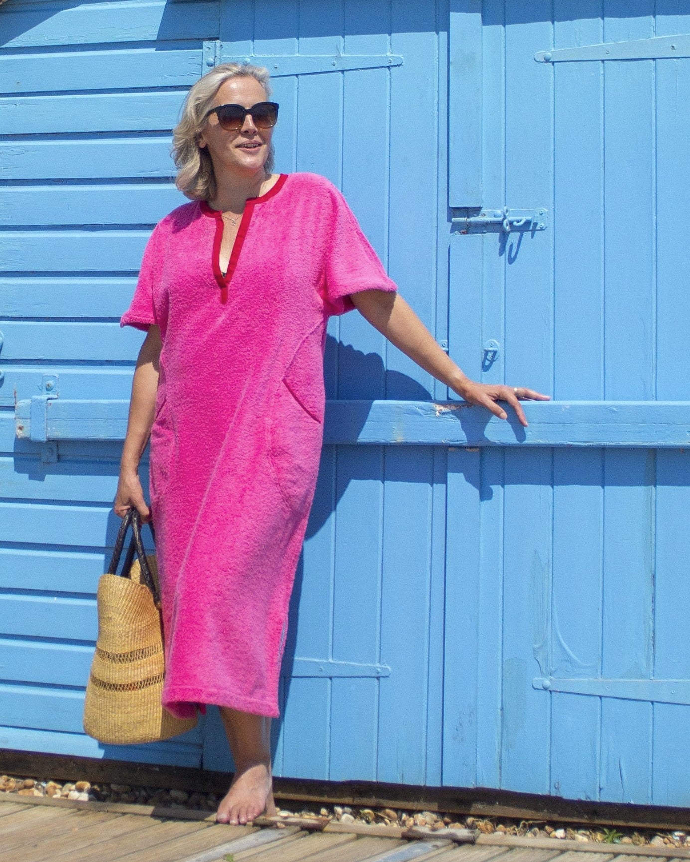 Long pink Kiss dress by So English featuring a stylish design, perfect for beachwear, made in the UK.