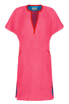Short pink Kiss dress by So English featuring a stylish, vibrant design, perfect for beachwear and casual summer outings.